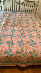 lot 1638 image: Hand sewn Quilt with Triangle Pattern, Coral Pink and Green 88X73