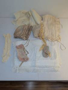 lot 1803 image: Antique doll and infant clothes