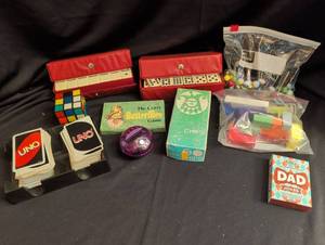 lot 1831 image: Games & Puzzles Lot UNO, Dominoes, Rubiks Cube, Butterflies Game, Poker Chips, Dad Jokes