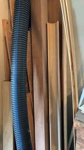 lot 2009 image: Mixed Lot Wood Trim Molding Pieces Corrugated Flexible Hose and Paver Bricks