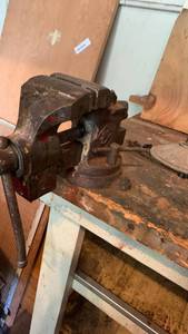 lot 2038 image: Bench Vise with Swivel Base and Red Painted Accents- needs to be removed please bring tools