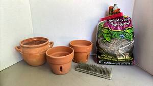 lot 2200 image: Two orchid pots, one pot with handles, a flower pot frog and Spanish moss