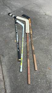 lot 2211 image: Lot of 4 Ice Hockey Sticks Bauer CCM Louisville