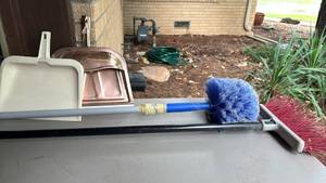 lot 2213 image: Two brooms and dust pans