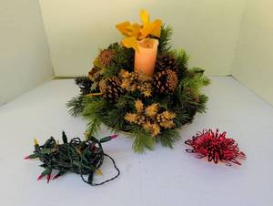 lot 2423 image: Holiday Floral Arrangement with Candle, Pinecones, Greenery and Light String