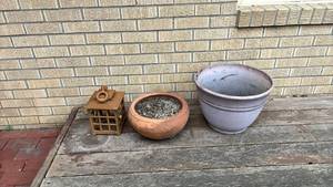 lot 3000 image: Two planters and an outdoor lantern