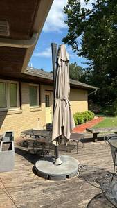 lot 3011 image: Offset Patio Umbrella with Base and Cover.  May have holes in umbrella