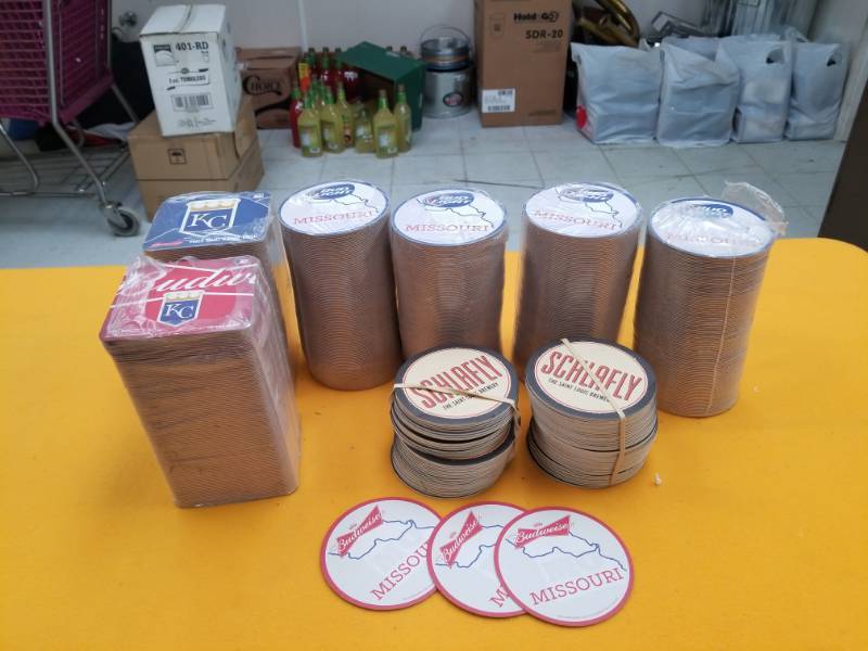 lot 6379 image: Six Full Sleeves and Two Part Sleeves of Paper Coasters - Various Logos