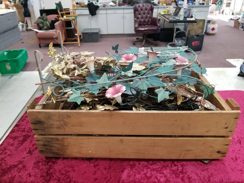 lot 6601 image: Wood Crate full of Metal Wall Art Dcor Piecs