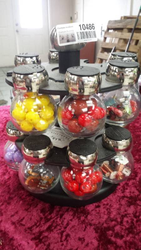 lot 10486 image: Revolving Rack with Jars full of Baubles, Beads and Buttons