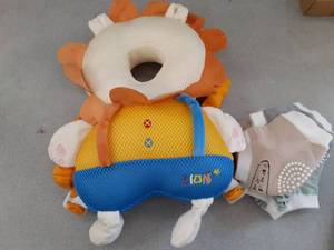 lot 214 image: Baby Head Protector Cushion Backpack with 3 Baby Knee Pads for Walking & Crawling.(Lion)