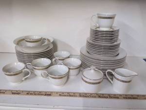 lot 1 image: Porcelain Dinnerware Set with Gold Trim Tea Service 44 Pieces