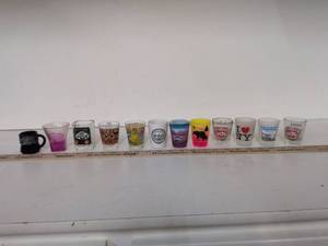 lot 41 image: Lot of 12 Assorted Souvenir Shot Glasses
