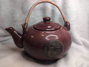 lot 1200 image: Vintage Teapot with Rattan Handle and Lid, Burgundy Red