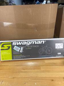 lot 1675 image: $60 Swagman Upright Roof Rack for Bikes- 1-Bike