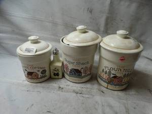 lot 27865 image: Flour Sugar and Coffee pots matching, and an olive oil dispenser
