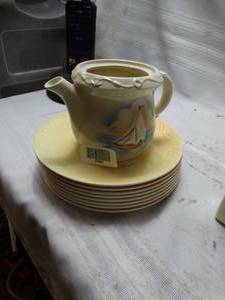 lot 27866 image: Solid Yellow kitchen Plates and a Yellow kitchen Tea pot pitcher with boat