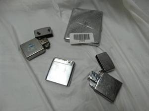 lot 27972 image: Lot of collectible lighters and cigarette holder