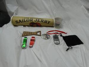 lot 27975 image: Sailor Jerrys collectible poster, and a collection of bottle openers