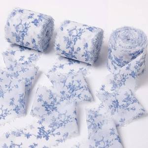 lot 97 image: Gilprop Wedding Chiffon Ribbon 1.5 Inch x 21 Yards Blue and White Floral Print Ribbons Frayed Edges Ribbons for Wrapping Gift Crafts Wreath Bouquet Bow Making - Retail $15