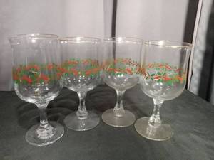 lot 6807 image: 4 Piece Glassware Set with Red Ribbon and Holly Print Decoration