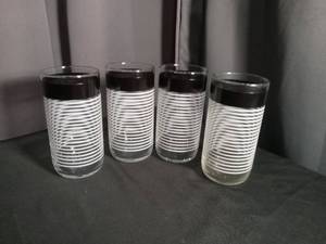 lot 6810 image: 4-Piece Glass Drinkware Set with Black Band and White Stripe Design