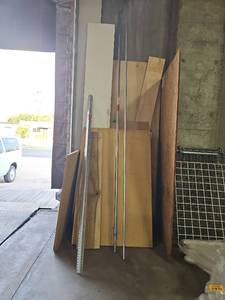 lot 1052 image: Mixed Lumber and Building Materials Lot - Sheet Panels, Metal Rods, Slotted Track All Materials Shown