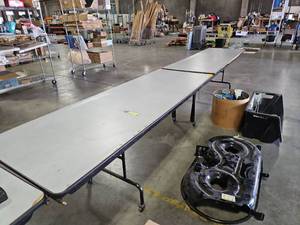lot 29643 image: Folding Banquet Table with Gray Top and Black Frame Rolls 14ft