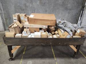 lot 59596 image: Surplus of new automotive parts. A majority are GPD air conditioning components. A mix of compressors, driers, hoses, lines and other parts. All items are scannable or can be cross referenced on rockauto or other sites.