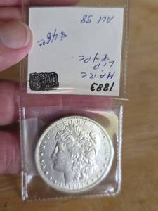 lot 9 image: 1883 AU Morgan silver dollar