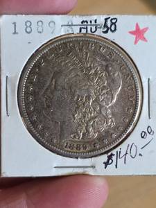lot 21 image: 1889 AU58 Morgan silver dollar
