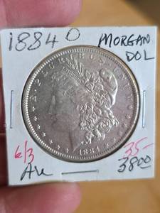 lot 49 image: 1884-O AU Morgan silver dollar