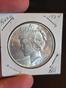 lot 57 image: 1924 AU Peace silver dollar