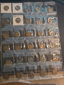 lot 217 image: Lot of 30 old what pennies,  3 of which are steal pennies