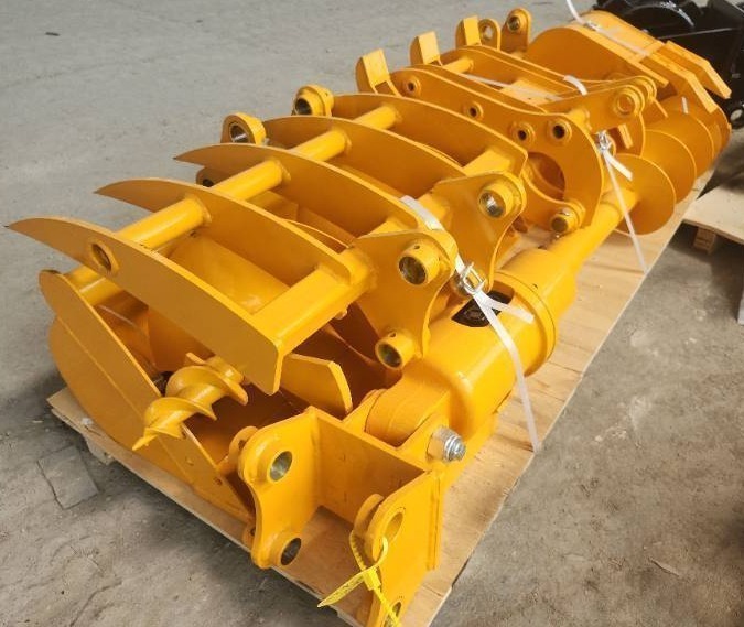 lot 8631 image: Unused CAT 301 - 8 Piece Attachment Set for Excavators - Includes Rake - Ripper - Grabber - 12-inch Auger - 16-inch Auger - 8-inch Narrow Bucket - 24-inch Bucket - 32-inch Bucket