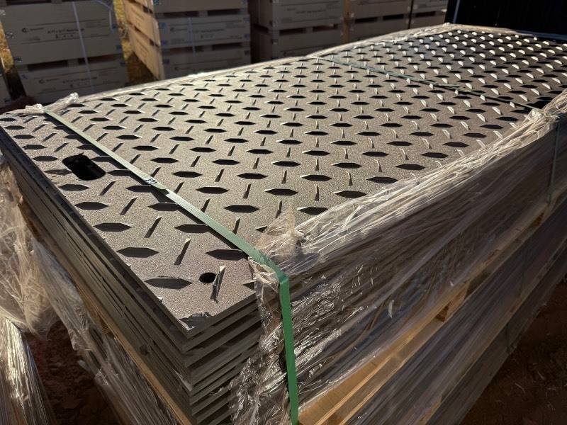 lot 5064 image: Set of 15 - Unused IRGPM 42in X 8ft X .5in Black Ground Protection Mats - High Density Polyethylene Diamond Plated Top, Smooth Plate Underneath Tread Design