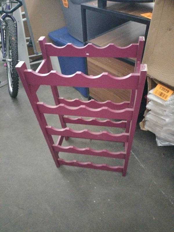 lot 63034 image: Purple free-standing wooden wine rack