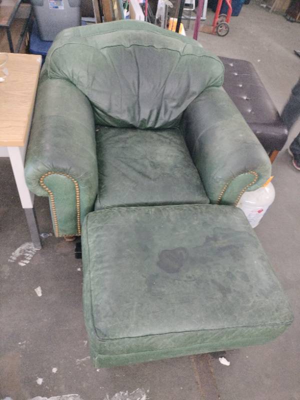 lot 63051 image: Green Leather Nailhead Trim Arm Chair and Ottoman Set