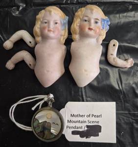lot 739 image: Mother of Pearl Mountain Scene Pendant and Bisque Baby Doll Body and Rt and Lt Arms