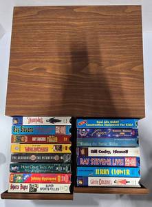 lot 835 image: VHS Tape Collection Lot of 15 Movies in Storage Box