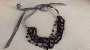 lot 129 image: Multi-strand Amethyst Beaded Necklace with Gray Ribbon Tie