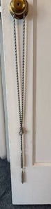 lot 130 image: Loooong Knotted Style Silver Tone Sweater Necklace with Rhinestone Tassel Accents