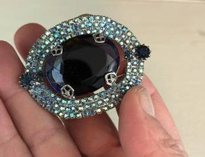 lot 132 image: Blue Brooch with Large Center Faux Blue (lighter than in pics) Gem and Rhinestone Pave Border