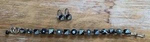 lot 329 image: Beaded Bracelet with Matching Earrings Set Black White Metal Charms