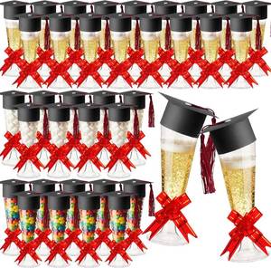 lot 14167 image: Dunzoom 72 Pack 72 Pack 2026 Graduation Candy Champagne Flute Plastic, Graduation Party Favors for Guests 5 oz Cocktail Disposable Box Jar and Mini Grad Cap with Tassel Pull Bow Glasses (Red)