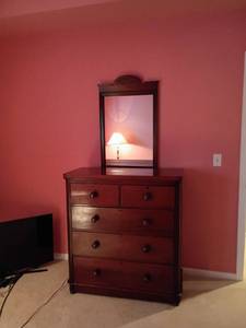 lot 937 image: Vintage Wooden Dresser with Decorative Wall Mirror.    Dresser has 5 Drawers. Located upstairs.  42 x 40 x 19    Mirror 37 x 23