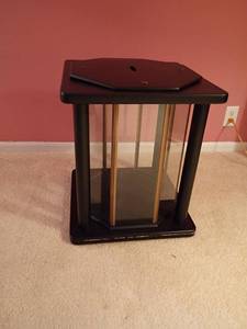 lot 942 image: Black End Table with Hexagon Shaped Glass in Between Top and Bottom.  Located upstairs.  21 x 17.5 x 17.5