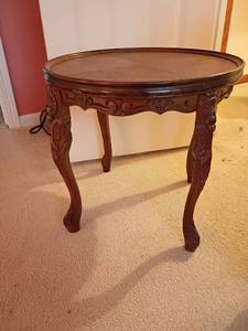 lot 943 image: Small Round Vintage Table.  With Carved Sides    Located upstairs.  18 x 19
