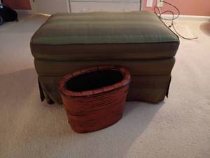lot 946 image: Ottoman and Wicker BasketTrashcan.   Located upstairs.  Ottoman 17 x 29 x 22