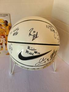 lot 1043 image: Wichita State University Shockers basketball autographed by several players, including Ron Baker, plus a 2014 Sports Illustrated featuring the WSU basketball team.